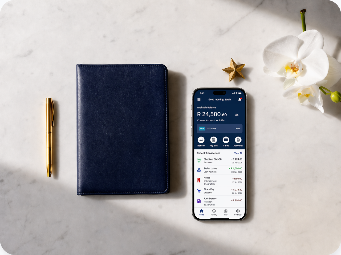Premium banking workspace with navy notebook and gold accents